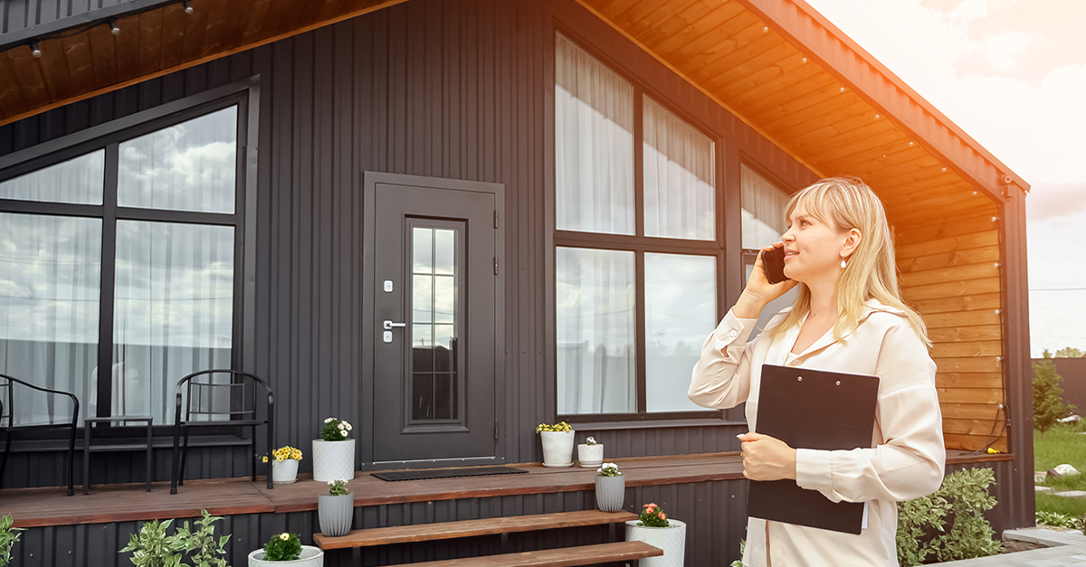 An agent outside of an empty house