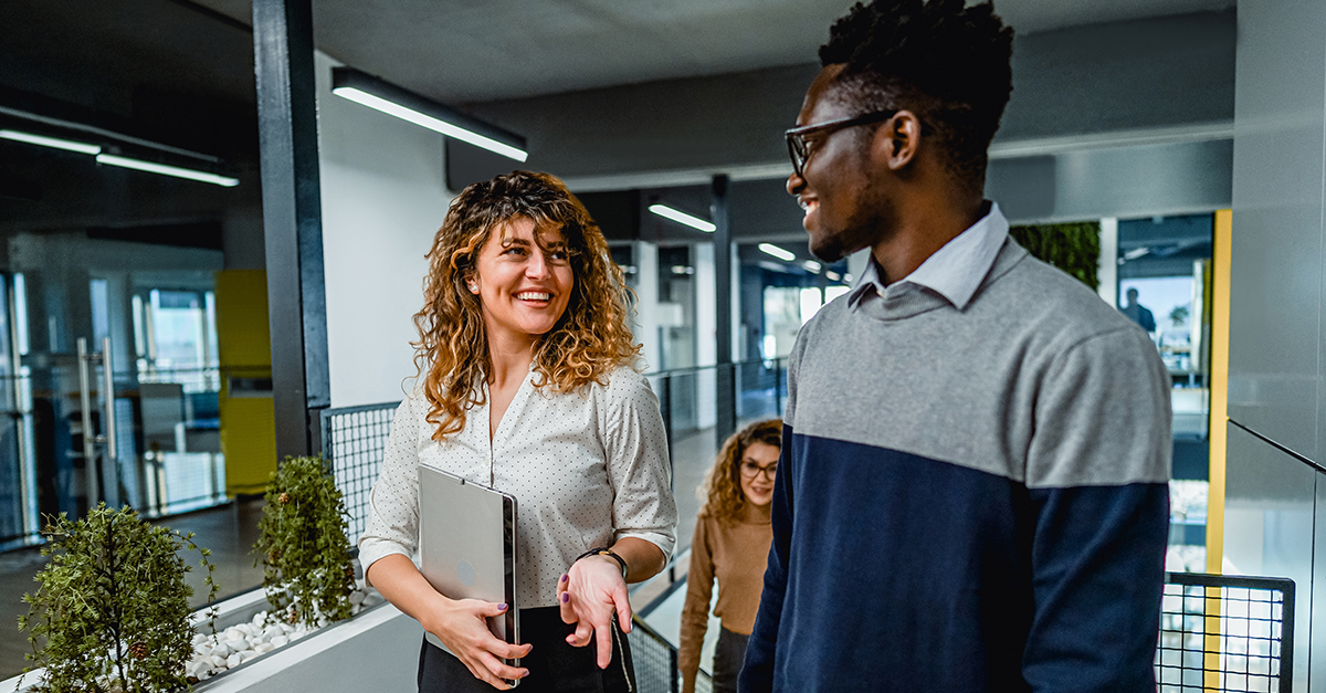 Two colleagues in an office talking