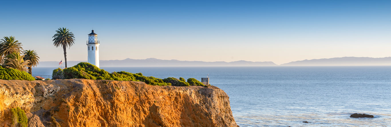 Lighthouse overlooking cliff and ocean